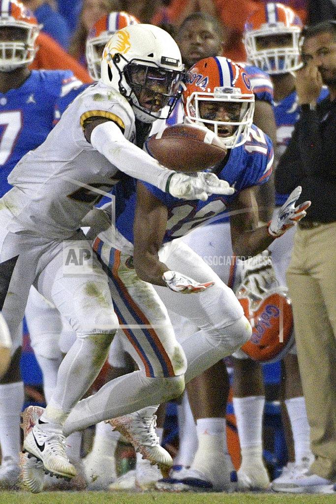 Phelan M. Ebenhack Missouri defensive back Christian Holmes (21) knocks away a pass intended for Florida wide receiver Van Jefferson (12) on a fourth-down play, forcing a turnover on downs, during the second half of an NCAA college football game Saturday, Nov. 3, 2018, in Gainesville, Fla. (AP Photo/Phelan M. Ebenhack)