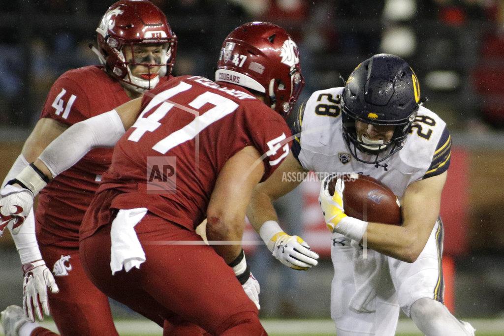 Young Kwak California running back Patrick Laird (28) runs while defended by Washington State linebacker Peyton Pelluer (47) during the second half of an NCAA college football game in Pullman, Wash., Saturday, Nov. 3, 2018. Washington State won 19-13. (AP Photo/Young Kwak)