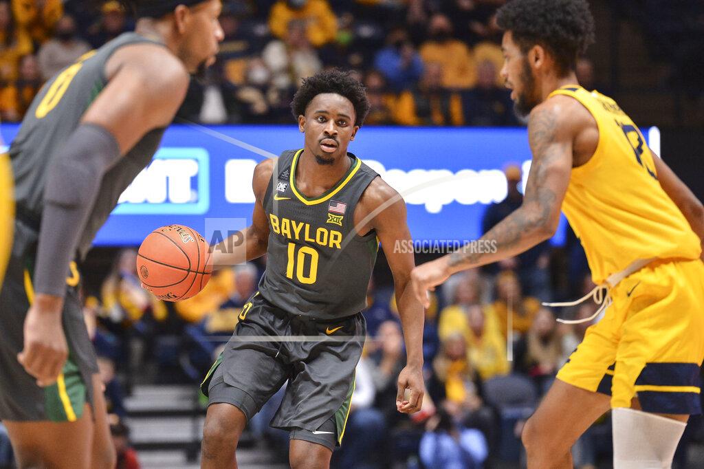 William Wotring Baylor guard Adam Flagler (10) works the ball down the court against West Virginia during the second half of an NCAA college basketball game in Morgantown, W.Va., Tuesday, Jan. 18, 2022. (William Wotring)