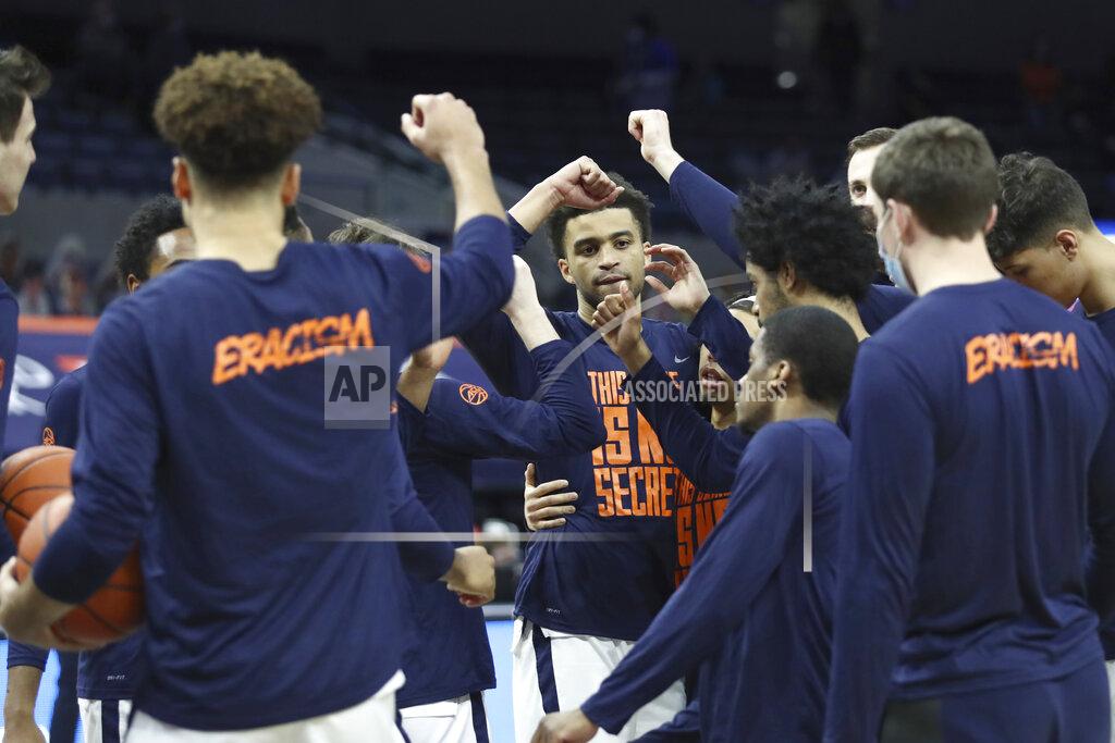 Erin Edgerton Virginia players gather before an NCAA college basketball game against Pittsburgh, Saturday, Feb. 6, 2021, in Charlottesville, Va. (Erin Edgerton/The Daily Progress via AP, Pool)