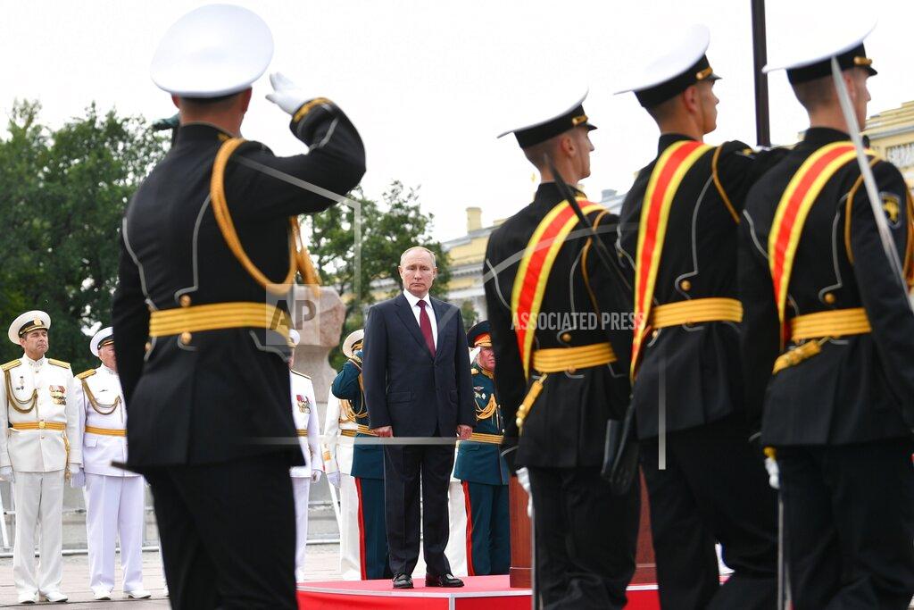Alexei Nikolsky Russian President Vladimir Putin, center, attends the Navy Day parade in St.Petersburg, Russia, Sunday, July 25, 2021. (Alexei Nikolsky, Sputnik, Kremlin Pool Photo via AP)