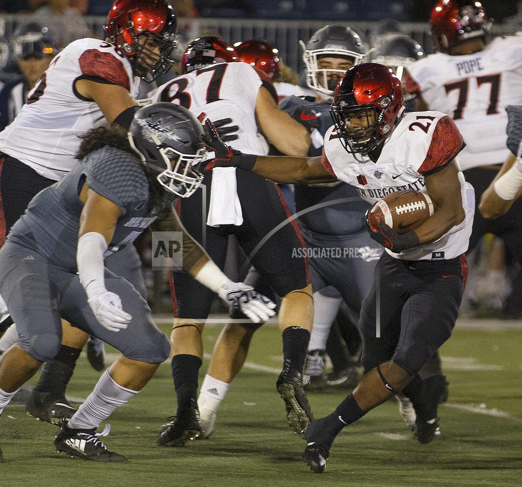 Tom R. Smedes San Diego State running back Chance Bell (21) runs against Nevada in the first half of an NCAA college football game in Reno, Nev., Saturday, Oct. 27, 2018. (AP Photo/Tom R. Smedes)