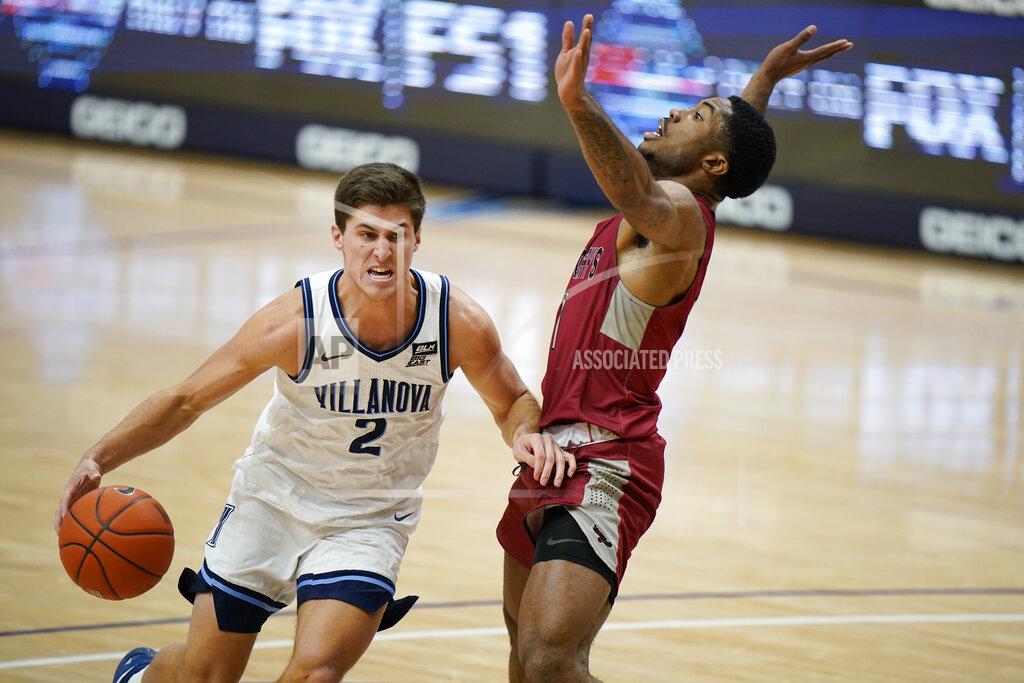 Matt Slocum Villanova's Collin Gillespie, left, drives past Saint Joseph's Rahmir Moore during the first half of an NCAA college basketball game, Saturday, Dec. 19, 2020, in Villanova, Pa. (AP Photo/Matt Slocum)