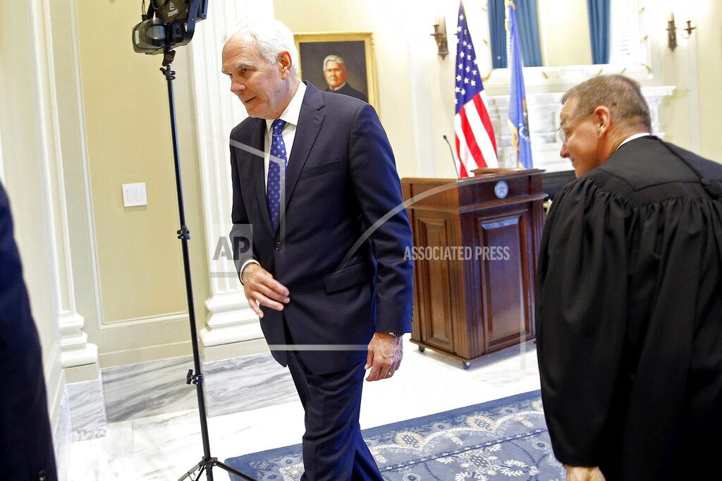 Bryan Terry John O'Connor leaves the room after being sworn in as Oklahoma's new attorney general at the state Capitol in Oklahoma City, Friday, July 23, 2021. Gov. Kevin Stitt named 66-year-old O'Connor to the post on Friday after a two-month search. (Bryan Terry/The Oklahoman via AP)