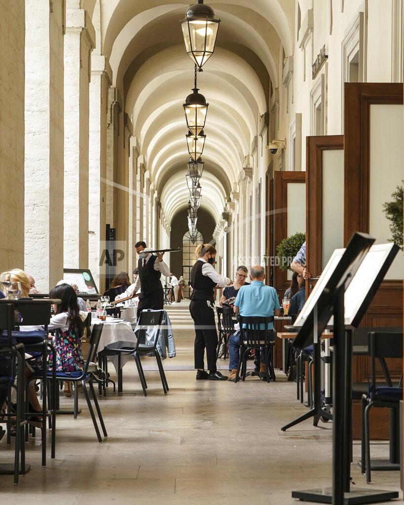 Laurent Cipriani People enjoy a meal in a restaurant during the nationwide reopening of restaurants, in Lyon, central France, Wednesday, June 9, 2021. (AP Photo/Laurent Cipriani)