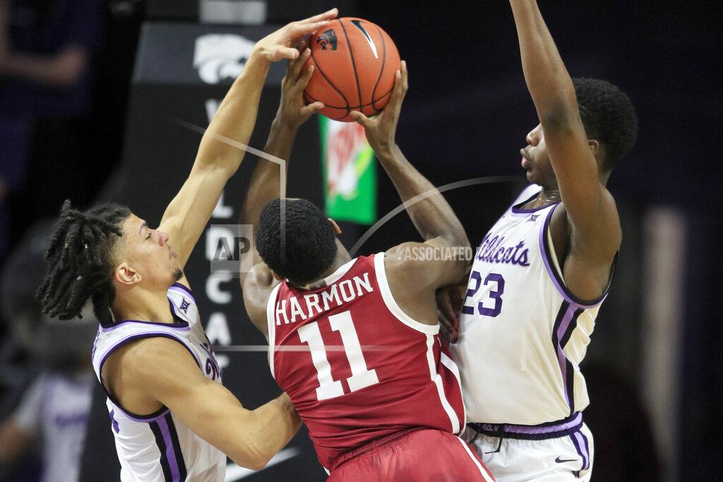 Orlin Wagner Oklahoma guard De'Vion Harmon (11) has a shot blocked by Kansas State guard Mike McGuirl, left, with help from forward Montavious Murphy (23) during the second half of an NCAA college basketball game in Manhattan, Kan., Wednesday, Jan. 29, 2020. Kansas State won 61-53. (AP Photo/Orlin Wagner)