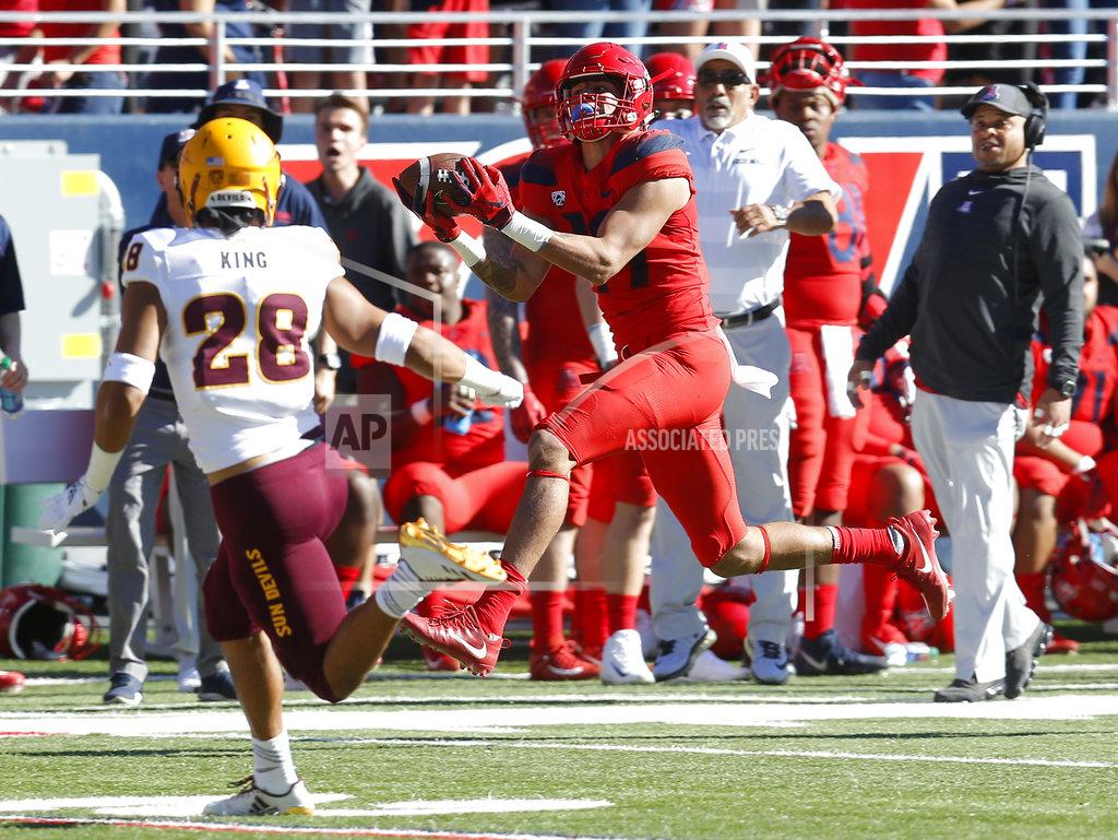 Rick Scuteri Arizona wide receiver Shawn Poindexter makes a catch for a first down in front of Arizona State defensive back Demonte King (28) in the first half during an NCAA college football game, Saturday, Nov. 24, 2018, in Tucson, Ariz. (AP Photo/Rick Scuteri)