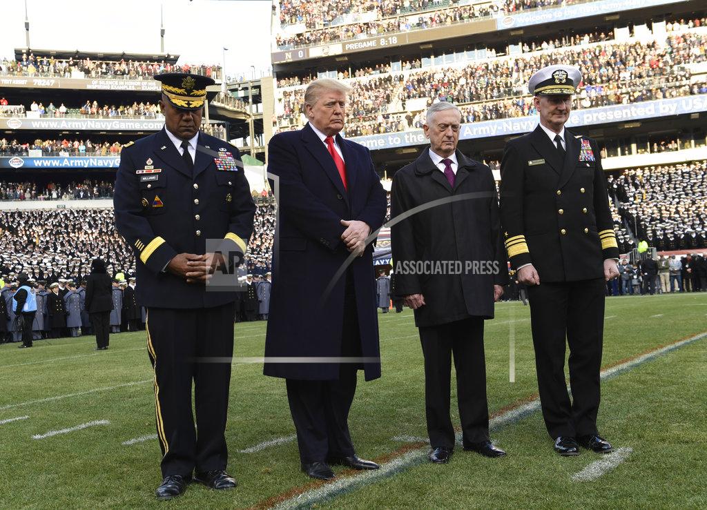 Susan Walsh President Donald Trump, second from left, is joined by, from left, West Point Superintendent Lt. Gen. Darryl A. Williams, Defense Secretary Jim Mattis and Naval Academy Superintendent Vice Adm. Ted Carter, for a moment of silence for former President George H.W. Bush before the start of the Army-Navy NCAA college football game in Philadelphia, Saturday, Dec. 8, 2018. (AP Photo/Susan Walsh)