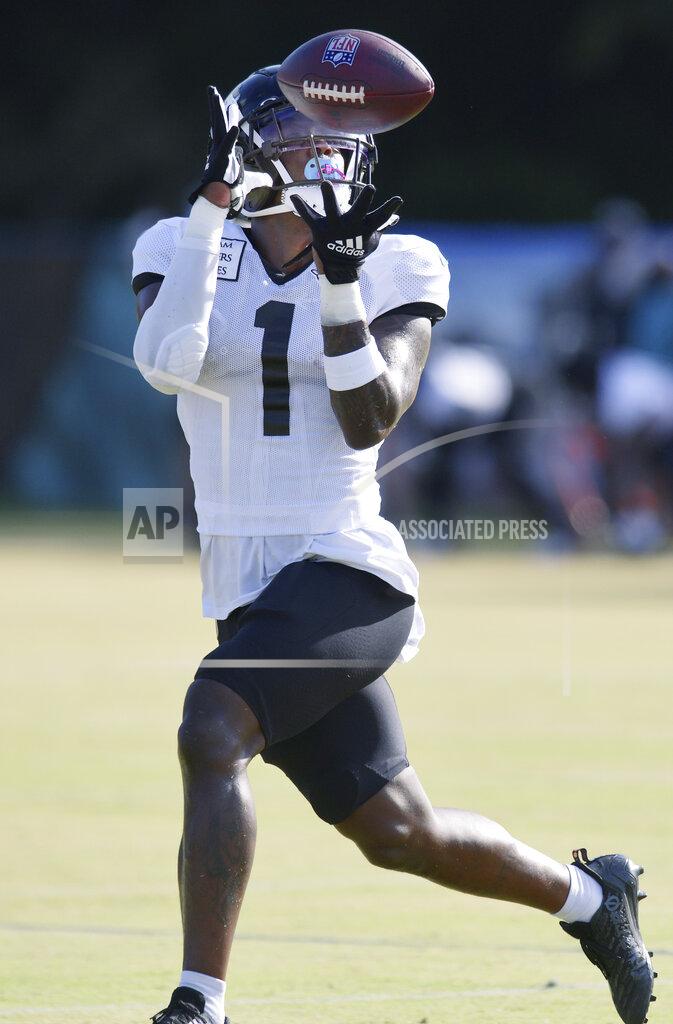 Bob Self Jacksonville Jaguars running back Travis Etienne Jr. (1) pulls in a pass during the NFL football team's training camp, Monday, Aug. 1, 2022, in Jacksonville, Fla. (Bob Self/The Florida Times-Union via AP)