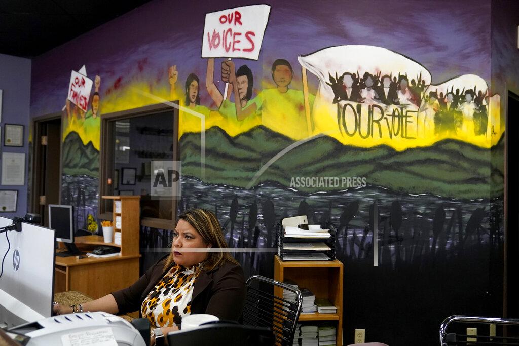 Jeff Roberson Irma Chavez works inside a nonprofit immigrant resource center, Tuesday, March 9, 2021, in Springdale, Ark. Chavez came to the United States from her home in El Salvador in 1994 when she was 18 and later was granted temporary protected status. (AP Photo/Jeff Roberson)