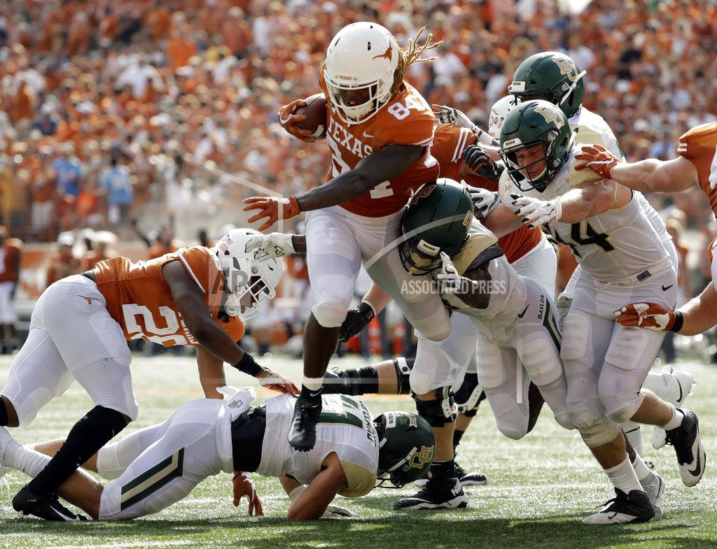 Eric Gay Texas wide receiver Lil'Jordan Humphrey (84) runs for a 3-yard touchdown against Baylor during the first half of an NCAA college football game, Saturday, Oct. 13, 2018, in Austin, Texas. (AP Photo/Eric Gay)