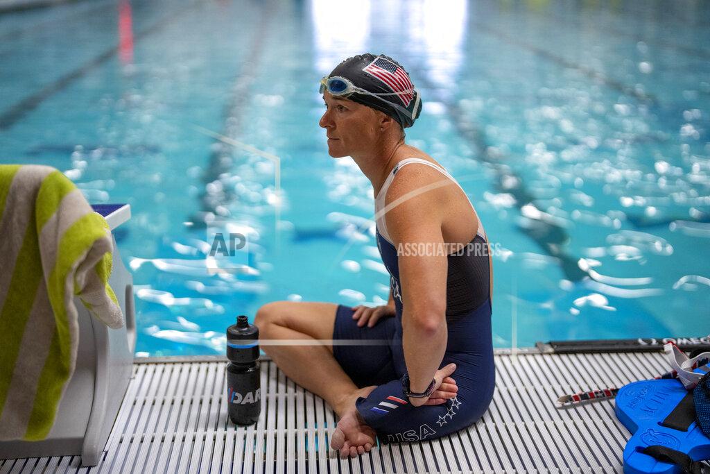 Emilio Morenatti Melissa Stockwell sits on the edge of a pool at a sports complex during her daily training in Colorado Springs, Colo., on Friday, Aug. 6, 2021. “I’m not saying it’s all unicorns and rainbows every day all day,” she said. But “I accepted the loss of my leg early on, and that acceptance propelled me.” (AP Photo/Emilio Morenatti)
