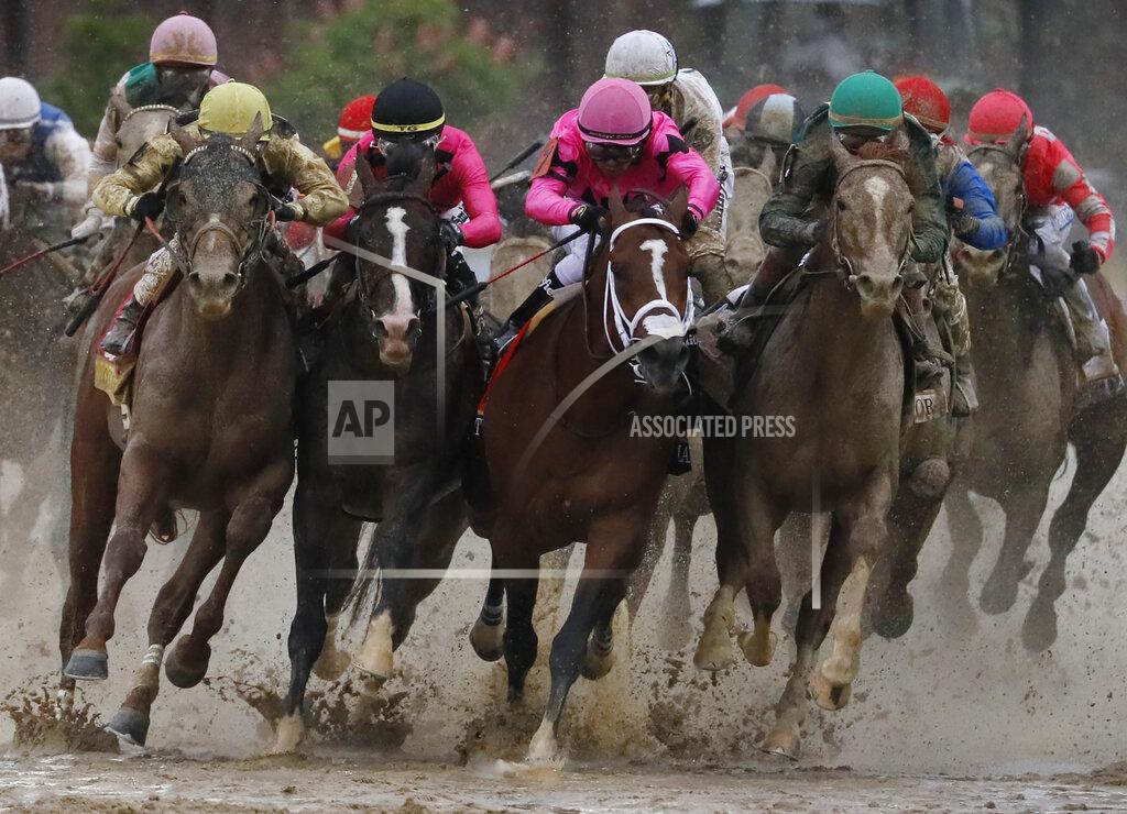 John Minchillo FILE - In this May 4, 2019, file photo, Flavien Prat on Country House, left, racing against Luis Saez on Maximum Security, third from left, during the 145th running of the Kentucky Derby horse race at Churchill Downs in Louisville, Ky. Derby? Boy, that’s one big muddle. The horse in front jumps a puddle. The stewards rule he interfered And take him down. How’s that for weird? (AP Photo/John Minchillo, File)