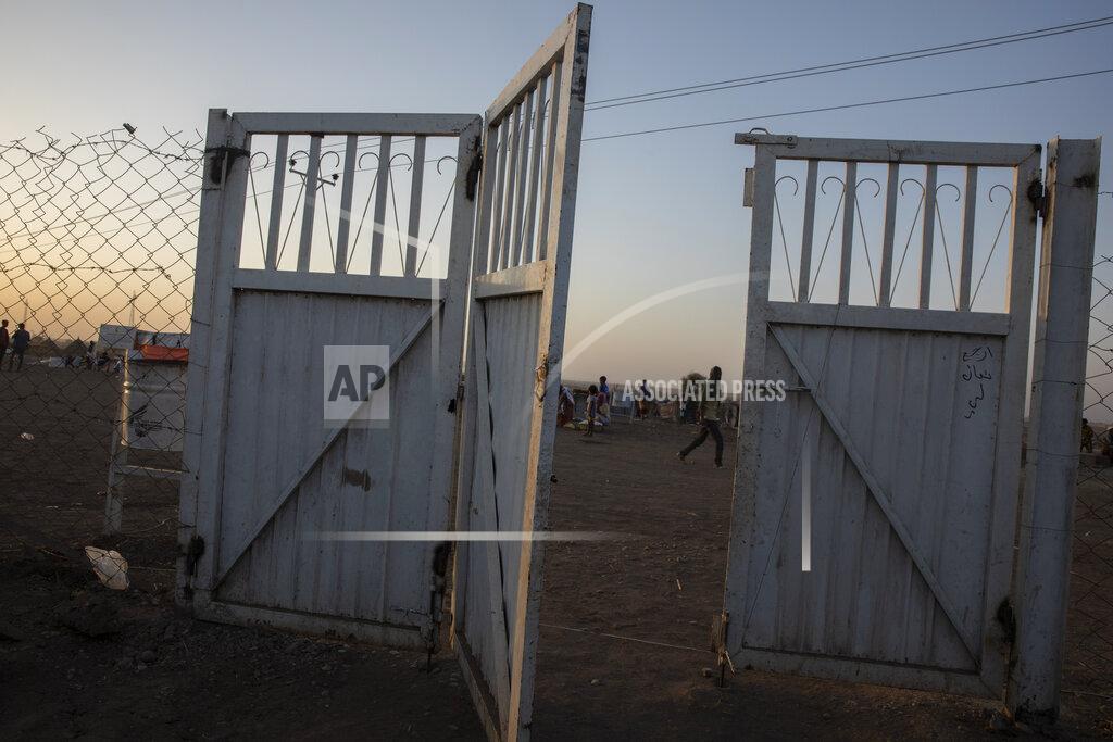 Nariman El-Mofty A gate stands open at the Sudanese Red Crescent clinic where surgeon and doctor-turned-refugee, Dr. Tewodros Tefera takes shelter and works in Hamdayet, eastern Sudan, near the border with Ethiopia, on March 22, 2021. (AP Photo/Nariman El-Mofty)