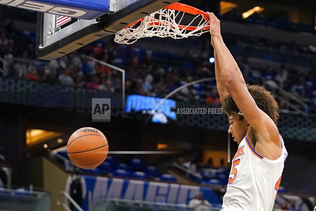 John Raoux New York Knicks' Jerico Sims dunks against the Orlando Magic during the first half of an NBA basketball game, Friday, Oct. 22, 2021, in Orlando, Fla. (AP Photo/John Raoux)
