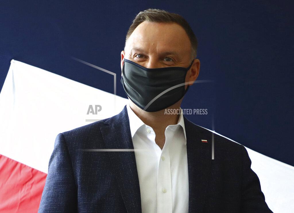 Beata Zawrzal File—File picture taken June 28, 2020 shows Poland's President Andrzej Duda casting his vote during presidential election in Krakow, Poland. Duda was tested positive on Corona. (AP Photo/Beata Zawrzal, file)