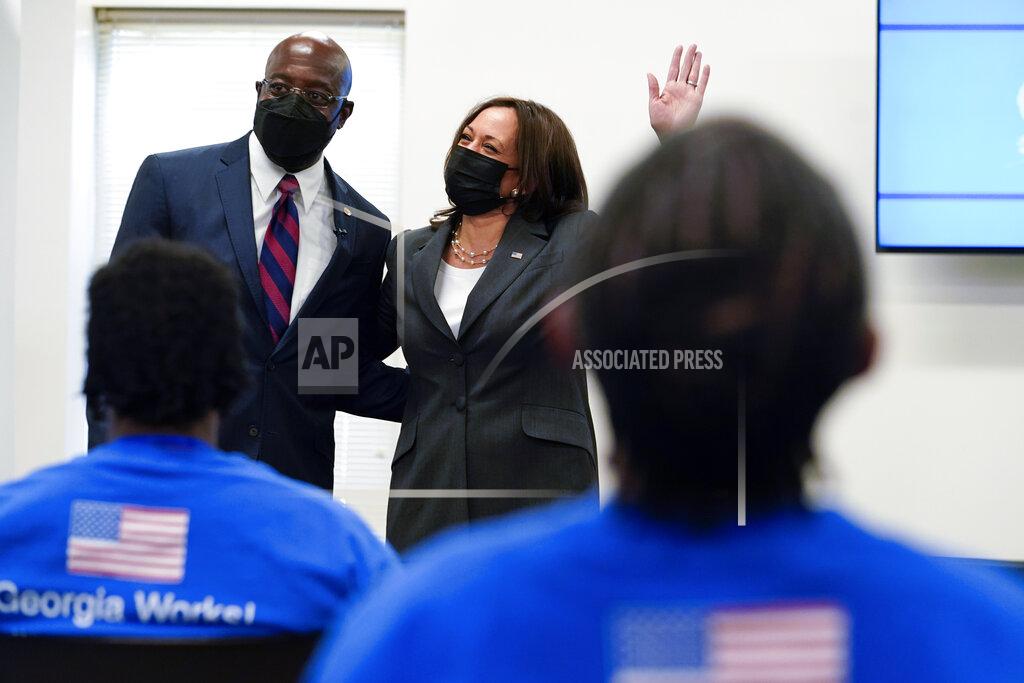 Jacquelyn Martin Vice President Kamala Harris stands with Sen. Raphael Warnock, D-Ga., as she speaks at a COVID-19 vaccine pop-up center at Ebenezer Baptist Church, Friday, June 18, 2021, in Atlanta. (AP Photo/Jacquelyn Martin)