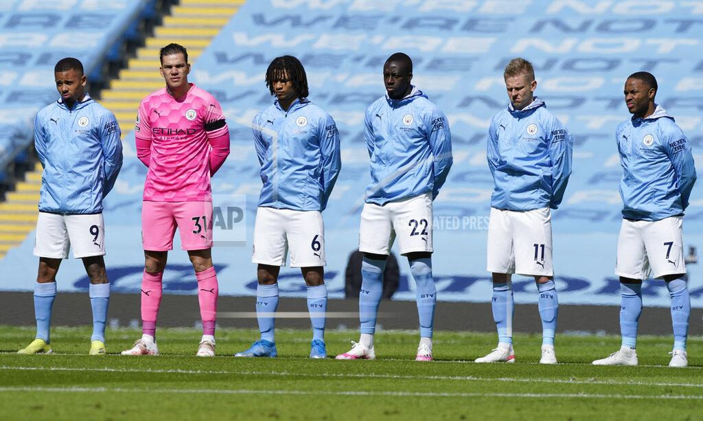 Tim Keeton Manchester City players stand for a two minute silence prior to kick off to mark the passing of Prince Philip at the English Premier League soccer match between Manchester City and Leeds United at Etihad Stadium, Manchester, England, Saturday April 10, 2021. (AP Photo/Tim Keeton,Pool)