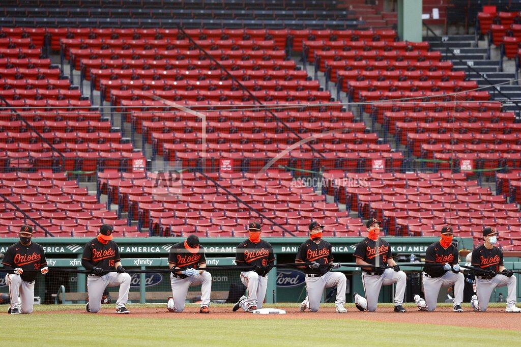 Michael Dwyer Baltimore Orioles players take a knee during a moment of silence in solidarity with Black Lives Matter before an opening day baseball game against the Boston Red Sox at Fenway Park, Friday, July 24, 2020, in Boston. (AP Photo/Michael Dwyer)