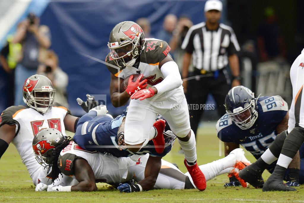 Mark Zaleski Tampa Bay Buccaneers running back Peyton Barber (25) carries the ball against the Tennessee Titans in the first half of an NFL football game Sunday, Oct. 27, 2019, in Nashville, Tenn. (AP Photo/Mark Zaleski)