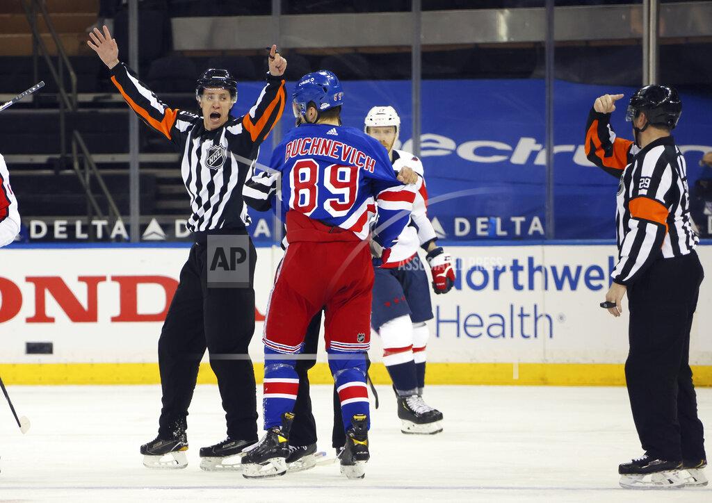 Bruce Bennett Referees TJ Luxmore and Ian Walsh (29) work the NHL hockey game between the New York Rangers and the Washington Capitals on Wednesday, May 5, 2021, in New York. (Bruce Bennett/Pool Photo via AP)