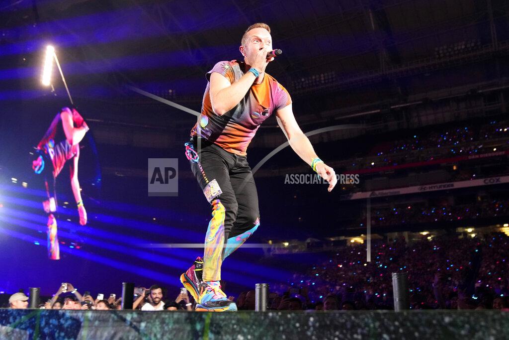 Rick Scuteri Chris Martin of Coldplay performs during the band's Music of the Spheres world tour on Thursday, May 12, 2022, at State Farm Stadium in Glendale, Ariz. (Photo by Rick Scuteri/Invision/AP)