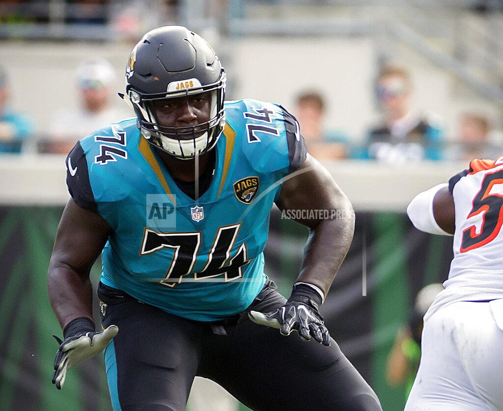 Stephen B. Morton FILE - In this Nov. 5, 2017, file photo, Jacksonville Jaguars offensive lineman Cam Robinson (74) drops back to block against the Cincinnati Bengals during the first half of an NFL football game in Jacksonville, Fla. The Jaguars likely will be without starting Robinson for their season opener. Robinson injured his right knee in practice Thursday and was listed as doubtful to play against Kansas City. (AP Photo/Stephen B. Morton, File)