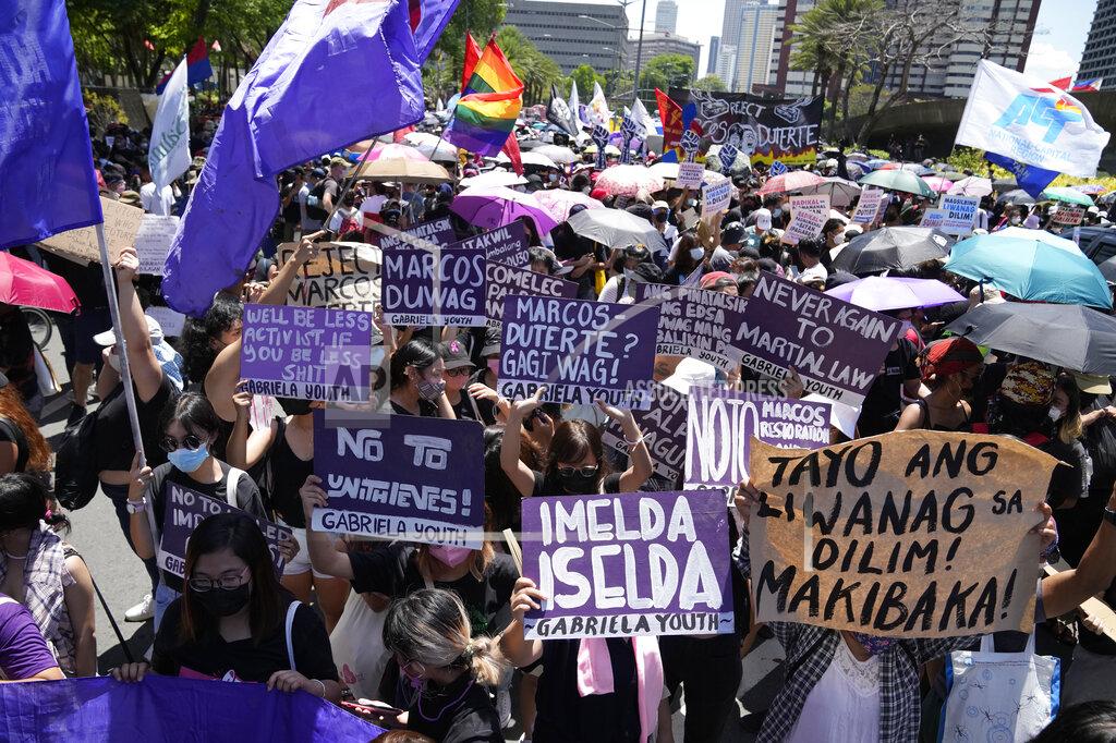 Aaron Favila Protesters hold slogans during a rally against presidential frontrunner Ferdinand "Bongbong" Marcos and running mate Sara Duterte, daughter of the current president, during a rally in Pasay, Philippines on Friday, May 13, 2022. Allies of the Philippines' presumptive next president, Marcos Jr., appear set to strongly dominate both chambers of Congress, further alarming activists after the late dictator's son scored an apparent election victory that will restore his family to the seat of power. (AP Photo/Aaron Favila)