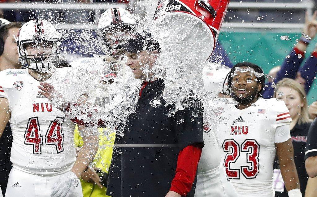 Carlos Osorio Northern Illinois head coach Rod Carey is doused during the closing seconds of the Mid-American Conference championship NCAA college football game against Buffalo, Friday, Nov. 30, 2018, in Detroit. (AP Photo/Carlos Osorio)