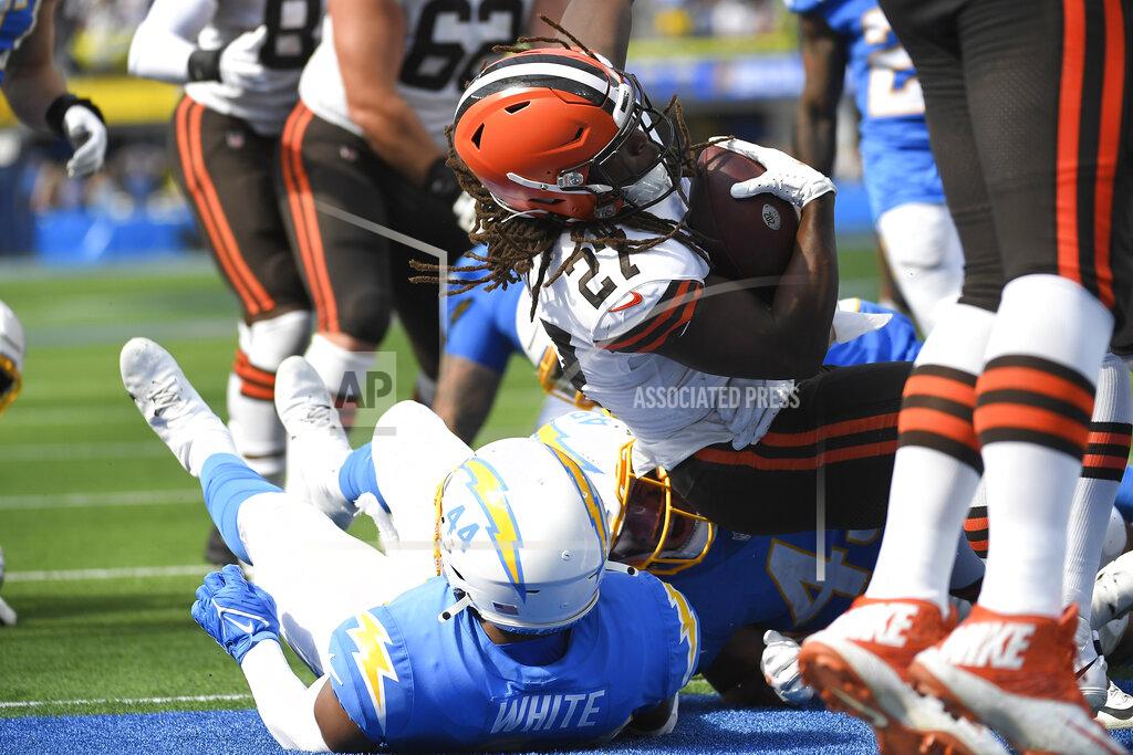 Kevork Djansezian Cleveland Browns running back Kareem Hunt top, scores a rushing touchdown over Los Angeles Chargers outside linebacker Kyzir White (44) during the first half of an NFL football game Sunday, Oct. 10, 2021, in Inglewood, Calif. (AP Photo/Kevork Djansezian)