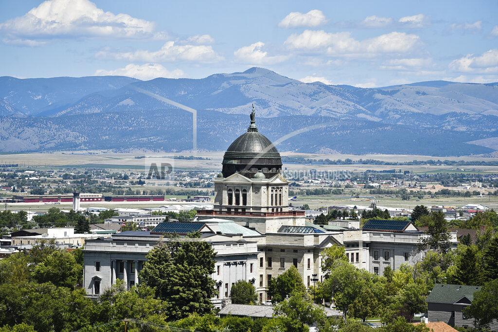Thom Bridge FILE - This July 2020 file photo shows the Montana State Capitol in Helena, Mont. Amid the coronavirus pandemic, Montana's legislature passed restrictive laws severely curbing quarantine and isolation powers, increasing local officials' power over local health boards, preventing limits on religious gatherings, and banning employers — including in health care settings — from requiring vaccinations for COVID, the flu or anything else. (Thom Bridge/Independent Record via AP, File)