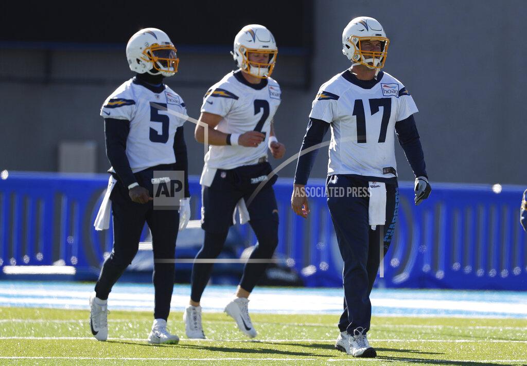David Zalubowski From left, Los Angeles Chargers quarterbacks Tyrod Taylor, Easton Stick and Philip Rivers take part in a drill during an NFL football practice Thursday, Nov. 14, 2019, at Air Force Academy, Colo. The Chargers are training at Air Force, which is at an elevation of 7,200 feet, to prepare for Monday night's game against Kansas City in Mexico City. (AP Photo/David Zalubowski)