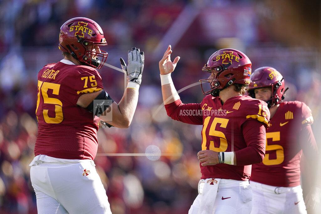Charlie Neibergall Iowa State quarterback Brock Purdy (15) celebrates with teammate Sean Foster (75) after throwing a touchdown pass during the first half of an NCAA college football game against Oklahoma State, Saturday, Oct. 23, 2021, in Ames, Iowa. (AP Photo/Charlie Neibergall)