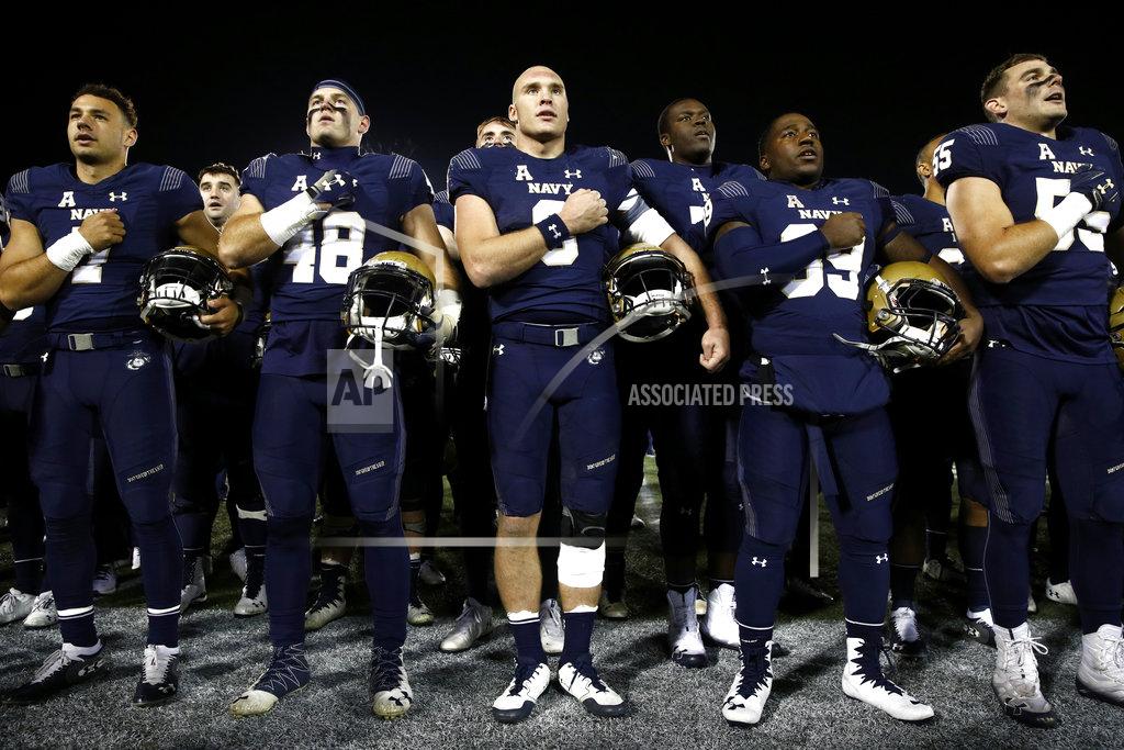 Patrick Semansky Navy quarterback Zach Abey, center, sings "Navy Blue and Gold" alongside teammates after an NCAA college football game against Tulsa, Saturday, Nov. 17, 2018, in Annapolis, Md. Navy won 37-29. (AP Photo/Patrick Semansky)