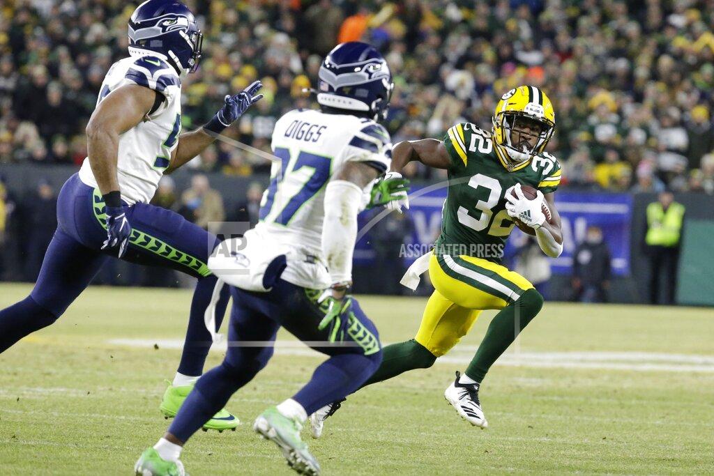 Mike Roemer Green Bay Packers' Tyler Ervin runs during the first half of an NFL divisional playoff football game against the Seattle Seahawks Sunday, Jan. 12, 2020, in Green Bay, Wis. (AP Photo/Mike Roemer)