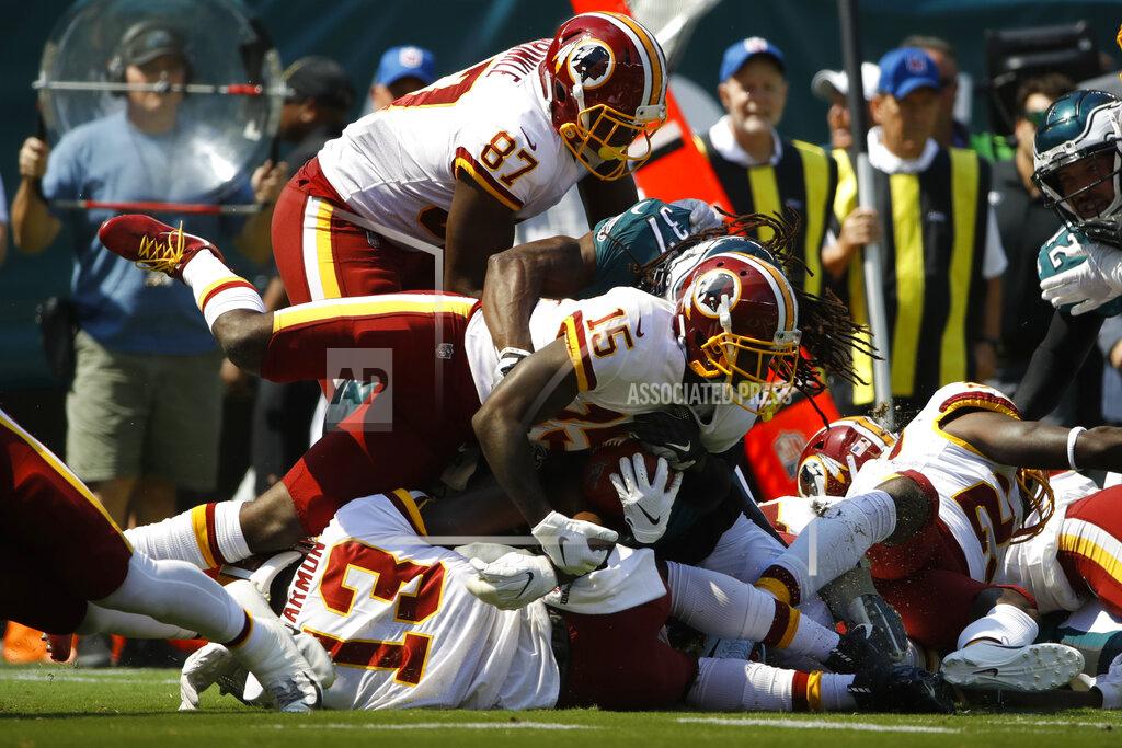 Matt Rourke Washington Redskins' Steven Sims (15) is tackled by Philadelphia Eagles' Johnathan Cyprien (37) after returning a kick during the first half of an NFL football game against the Philadelphia Eagles, Sunday, Sept. 8, 2019, in Philadelphia. (AP Photo/Matt Rourke)