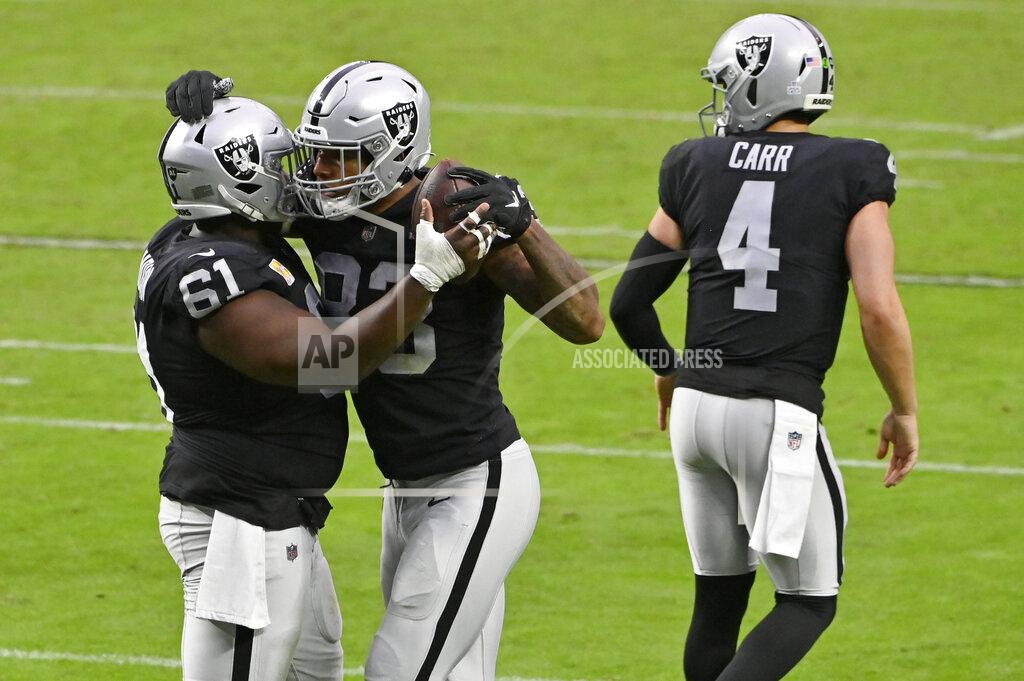 David Becker Las Vegas Raiders center Rodney Hudson (61) celebrates with tight end Darren Waller (83) after Waller scored a touchdown against the Tampa Bay Buccaneers during the second half of an NFL football game, Sunday, Oct. 25, 2020, in Las Vegas. (AP Photo/David Becker)