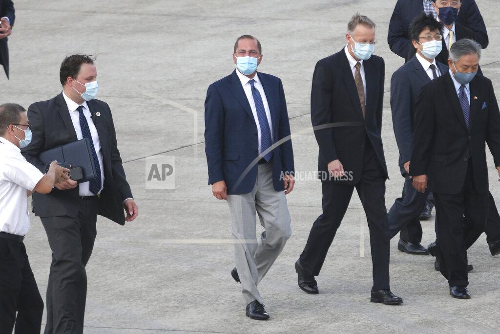 Chiang Ying-Ying U.S. Health and Human Services Secretary Alex Azar, center, arrives at Taipei Songshan Airport in Taipei, Taiwan, Sunday, Aug. 9, 2020. Azar arrived in Taiwan on Sunday in the highest-level visit by an American Cabinet official since the break in formal diplomatic relations between Washington and Taipei in 1979. (AP Photo/Chiang Ying-ying)