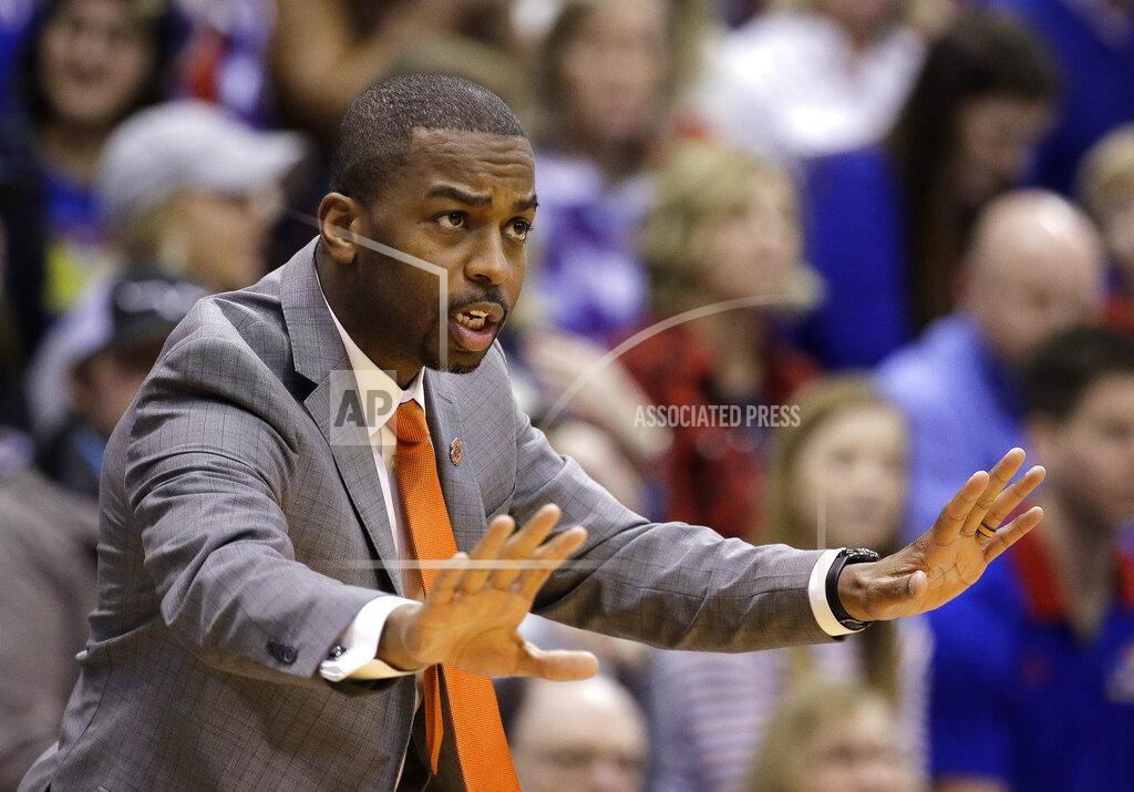 Charlie Riedel Oklahoma State head coach Mike Boynton, Jr. motions to his players during the first half of an NCAA college basketball game against Kansas Saturday, Feb. 9, 2019, in Lawrence, Kan. (AP Photo/Charlie Riedel)