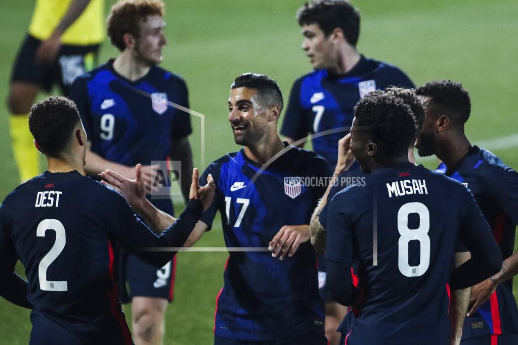 Ronald Zak US players celebrate after scoring the opening goal during the international friendly soccer match between USA and Jamaica at SC Wiener Neustadt stadium in Wiener Neustadt, Austria, Thursday, March 25, 2021. (AP Photo/Ronald Zak)