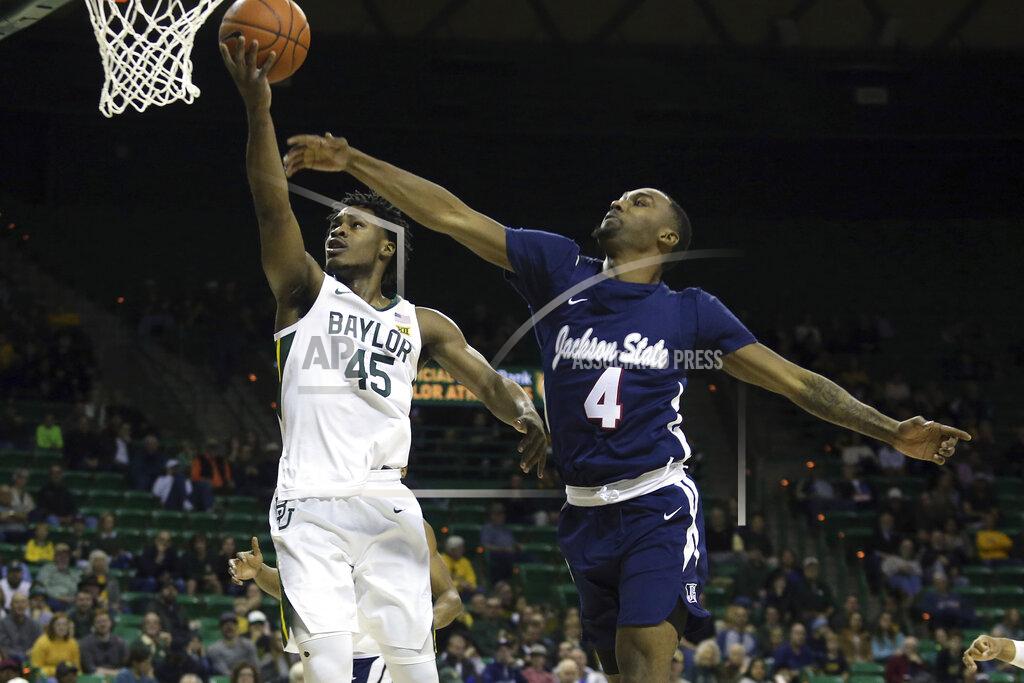 Jerry Larson Baylor guard Davion Mitchell (45) attempts a shot past Jackson State guard Tristan Jarrett (4) in the first half of an NCAA college basketball game, Monday, Dec. 30, 2019, in Waco, Texas. (AP Photo/Jerry Larson)