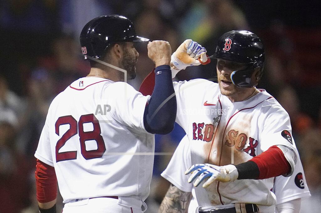 Charles Krupa Boston Red Sox's Trevor Story, right, celebrates with J.D. Martinez after his three-run home run against the Seattle Mariners in the eighth inning of a baseball game at Fenway Park, Thursday, May 19, 2022, in Boston. Story hit two two-run home runs earlier in the game. (AP Photo/Charles Krupa)