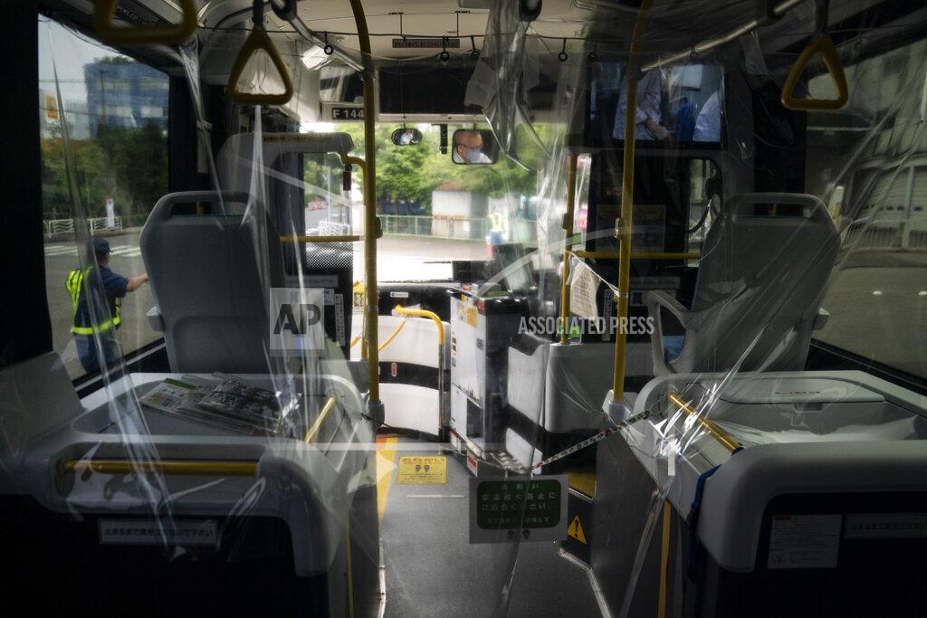 Jae C. Hong A protective plastic cover is installed in a shuttle bus to help curb the spread of COVID-19 prior to the 2020 Summer Olympics Sunday, July 11, 2021, in Tokyo. (AP Photo/Jae C. Hong)