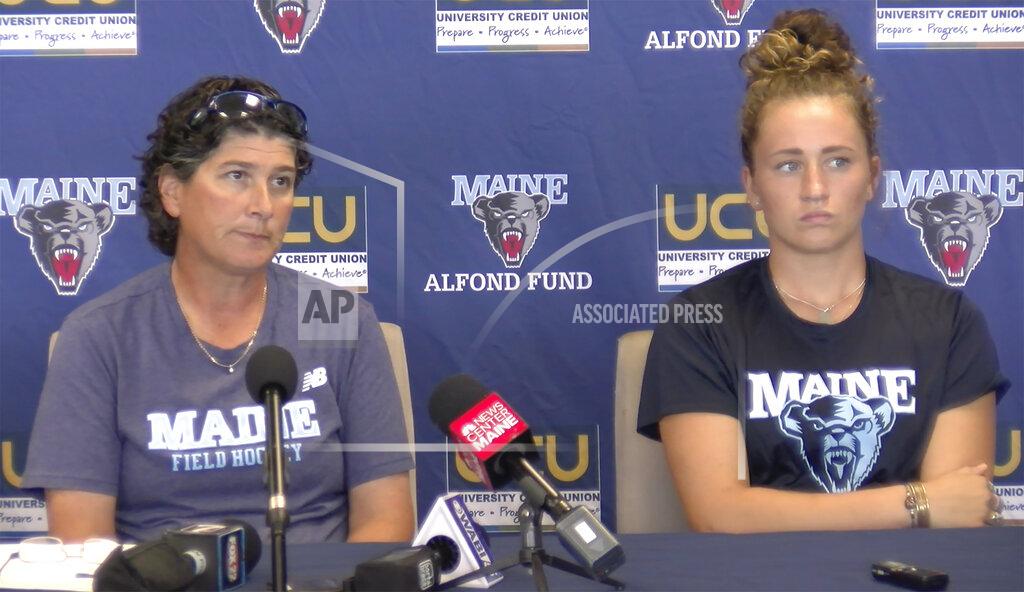 Uncredited University of Maine field hockey head coach Josette Babineau, left, and senior team captain Riley Field are shown during a press conference on Monday, Sept. 9, 2019, in Orono, Maine. After the shock wore off of halting a women's field hockey game in the middle of overtime just so they could shoot off fireworks for a football game that hadn't even started, the captain of the Maine team said it's par for the course when you're a female athlete. Indeed, for all the advances created by Title IX, there's still an awful lot of hearts and minds that still need changing. (University of Maine Athletics via AP)