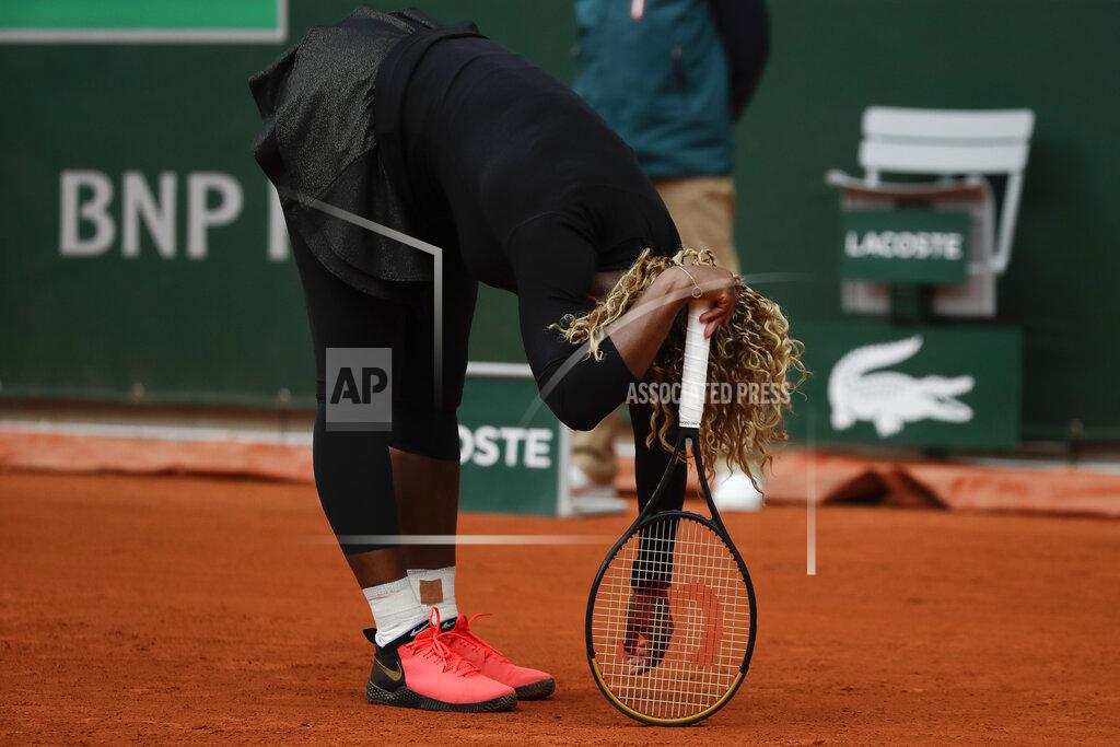 Alessandra Tarantino Serena Williams of the U.S. reacts after missing a shot against Kristie Ahn of the U.S. in the first round match of the French Open tennis tournament at the Roland Garros stadium in Paris, France, Monday, Sept. 28, 2020. (AP Photo/Alessandra Tarantino)