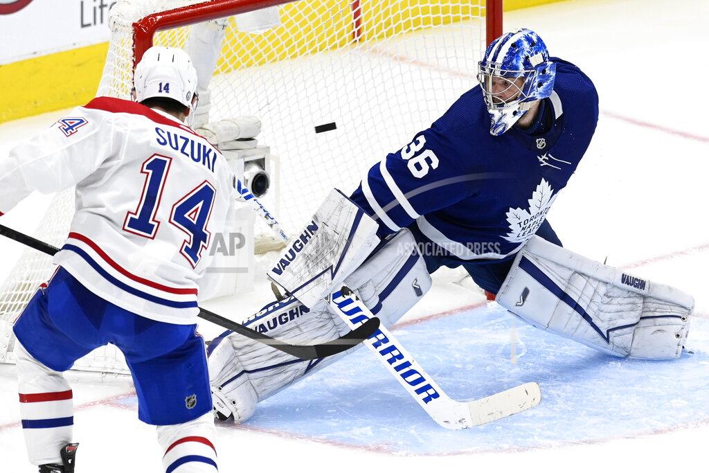Frank Gunn Montreal Canadiens centre Nick Suzuki (14) scores on Toronto Maple Leafs goaltender Jack Campbell (36) during overtime in Game 5 of an NHL hockey Stanley Cup first-round playoff series in Toronto on Thursday, May 27, 2021. (Frank Gunn/The Canadian Press via AP)
