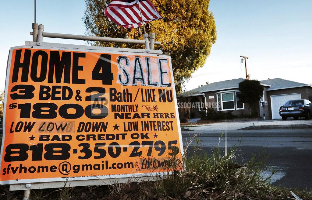 Richard Vogel FILE - This Jan. 17, 2015 photo shows a sign advertising a house for sale in Los Angeles. California gained population, but it was the slowest growth rate on record. California saw its slowest growth rate on record for the nation's most populous state, adding just 21,200 people during the year that ended in July, state officials said Wednesday, Dec. 16, 2020. (AP Photo/Richard Vogel, File)