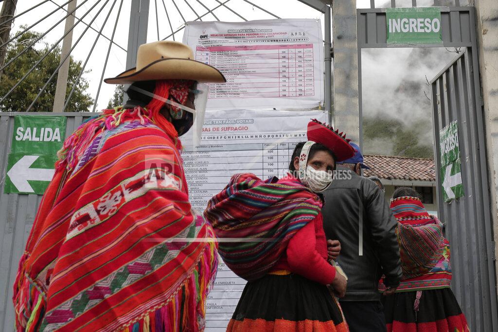 Sharon Castellanos Voters wearing masks to curb the spread of COVID-19 line up at a polling post during general elections in Ollantaytambo, Peru, Sunday, April 11, 2021. (AP Photo/Sharon Castellanos)