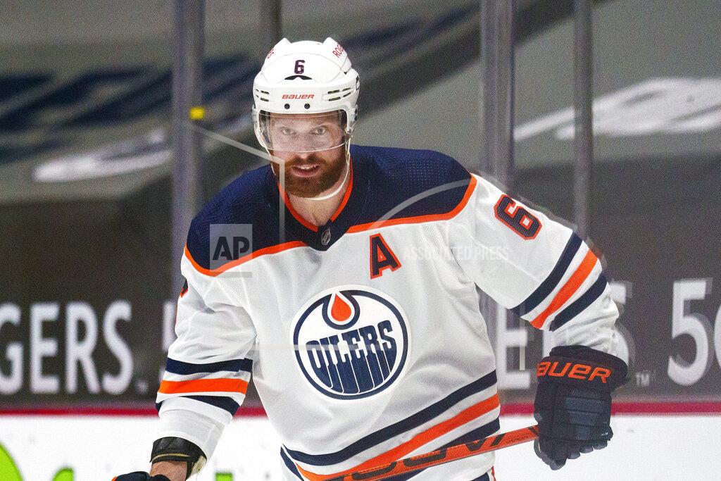 Nick Didlick FILE - Edmonton Oilers' Adam Larsson (6) is shown during an NHL hockey game against the Vancouver Canucks in Vancouver, British Columbia, in this Monday, May 3, 2021, file photo. Adam Larsson and Chris Driedger are going to the Seattle Kraken in the expansion draft. One person with knowledge of Larsson's deal said the defenseman has agreed to terms with Seattle on a $16 million, four-year contract. Another person with knowledge of Driedger's deal said the goaltender has agreed to a $10.5 million, three-year contract. The people spoke to The Associated Press on condition of anonymity Wednesday morning because the team was not announcing any moves until the expansion draft Wednesday night, July 21, 2021. (AP Photo/Nick Didlick, File)