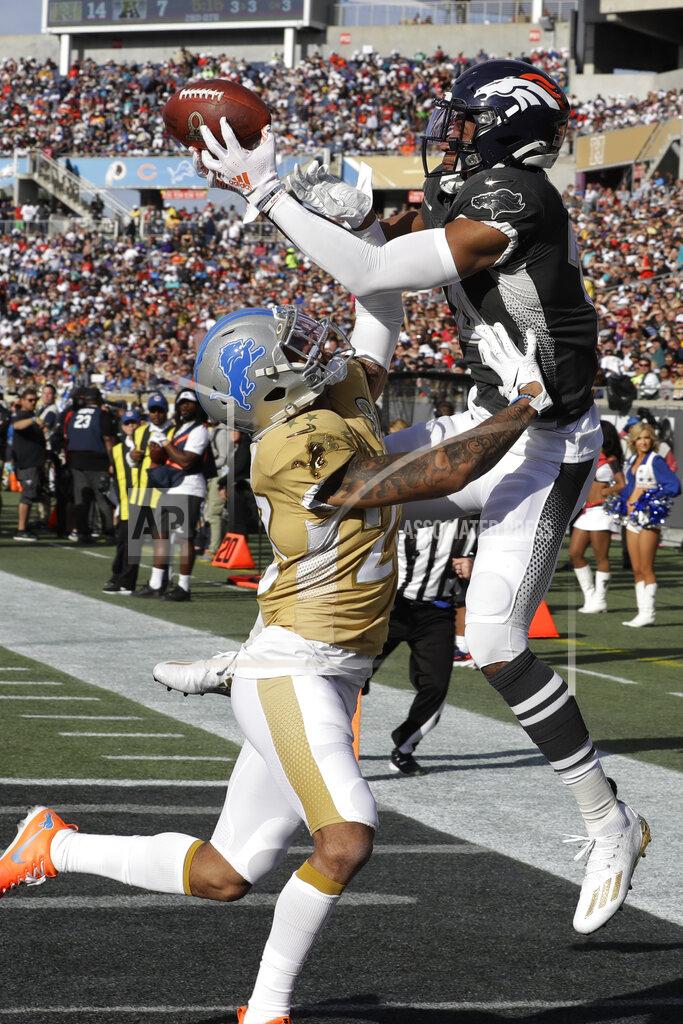 Chris O'meara AFC wide receiver Courtland Sutton, of the Denver Broncos, (14) attempts to hold onto a pass as NFC cornerback Darius Slay, of the Detroit Lions, (23) defends, during the first half of the NFL Pro Bowl football game, Sunday, Jan. 26, 2020, in Orlando, Fla. (AP Photo/Chris O'Meara)